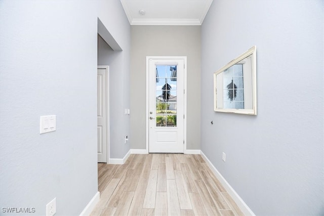 entryway featuring crown molding and light hardwood / wood-style floors