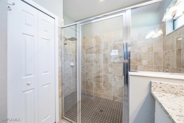 bathroom featuring vanity and walk in shower