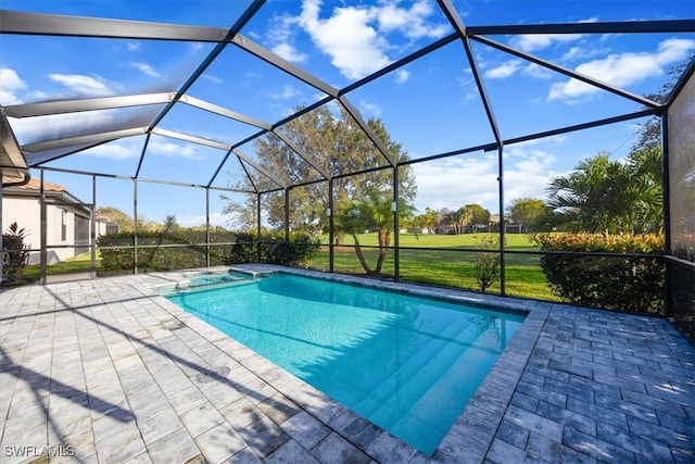 view of swimming pool featuring a patio, a lanai, and a yard