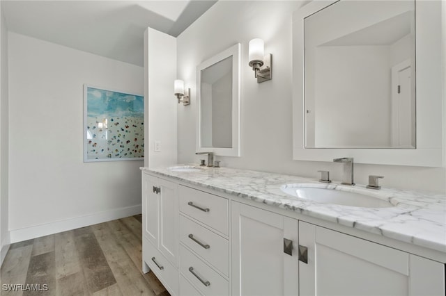 bathroom featuring vanity and wood-type flooring