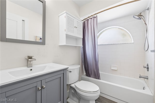 full bathroom with vanity, toilet, hardwood / wood-style flooring, and shower / tub combo