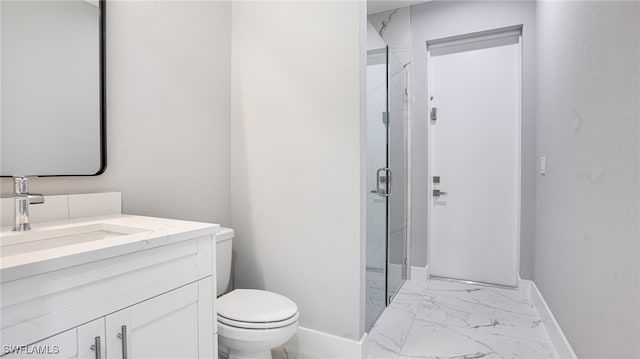 bathroom with vanity, toilet, and walk in shower