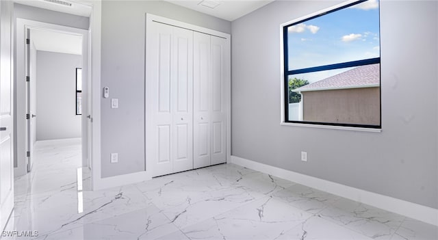 unfurnished bedroom featuring a closet