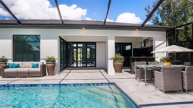 back of house featuring outdoor lounge area and a patio area