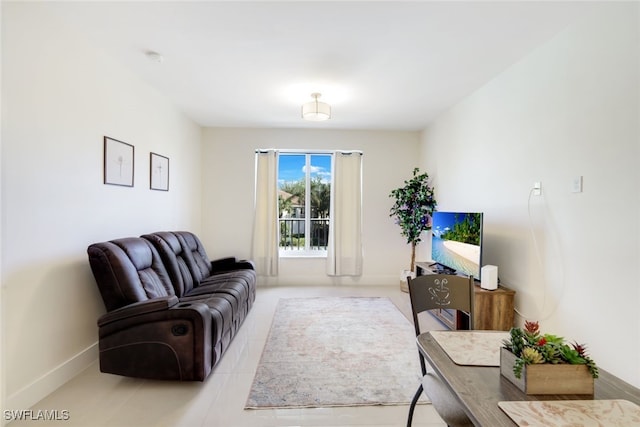 living room with light tile patterned flooring