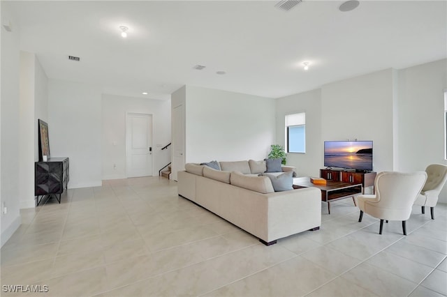 living room with light tile patterned floors