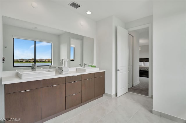 bathroom with vanity and tile patterned floors