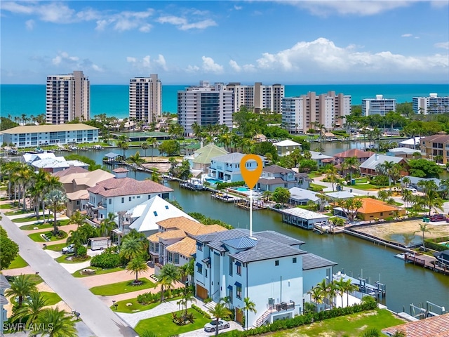 birds eye view of property with a water view