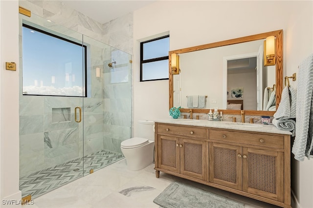 bathroom featuring vanity, toilet, and an enclosed shower