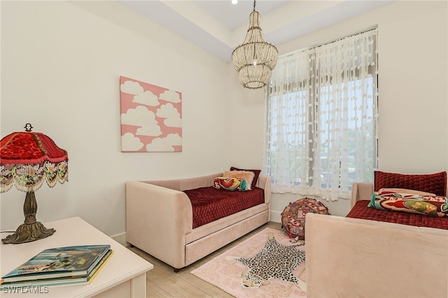 bedroom featuring a notable chandelier and light hardwood / wood-style floors