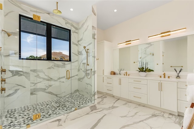 bathroom featuring vanity and a shower with door