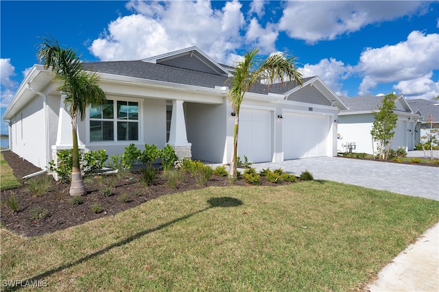 ranch-style home with a front lawn and a garage