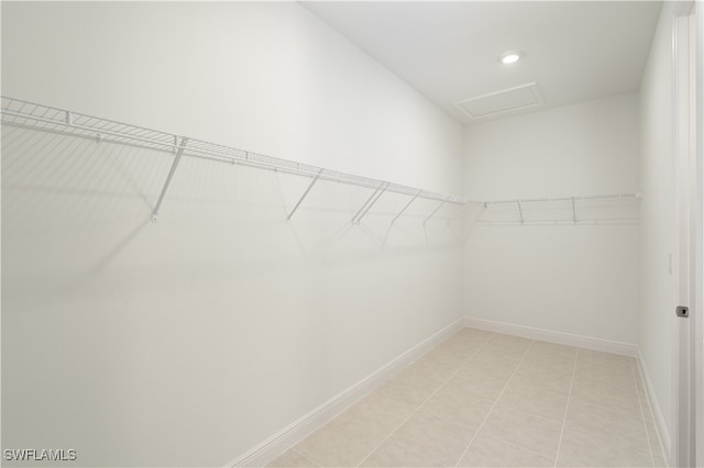 spacious closet featuring light tile patterned floors