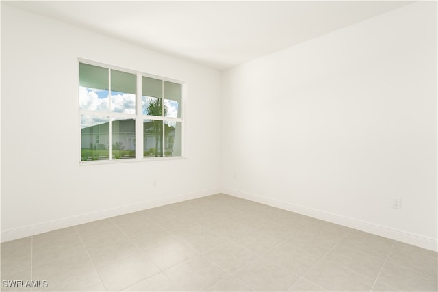 spare room featuring light tile patterned floors