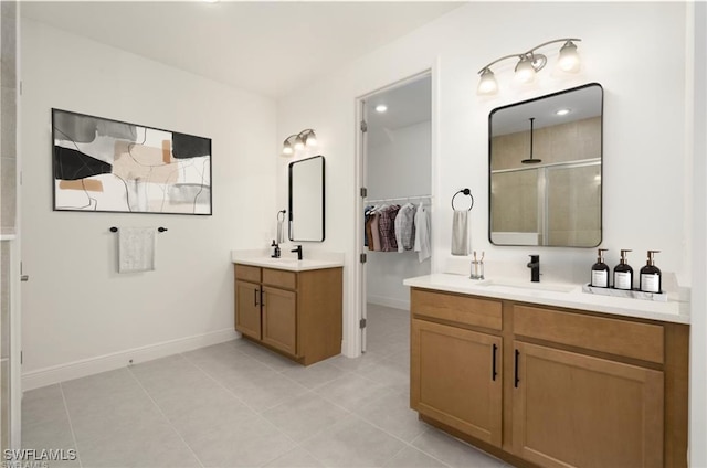 bathroom with vanity, walk in shower, and tile patterned flooring