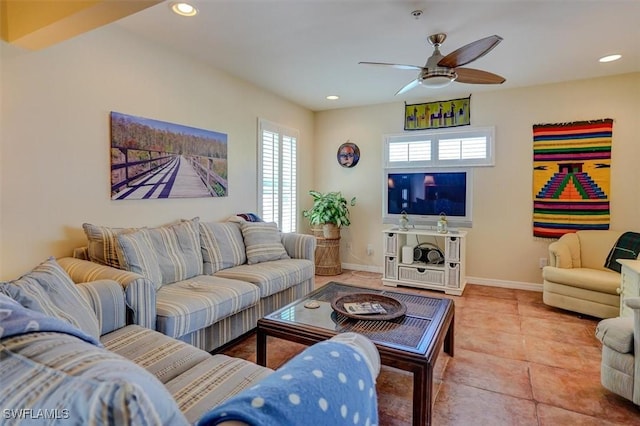 tiled living room with ceiling fan