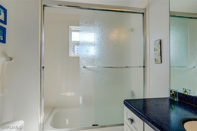 bathroom featuring vanity and toilet