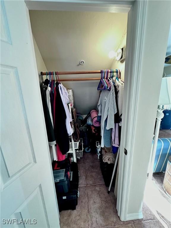 walk in closet featuring tile patterned flooring