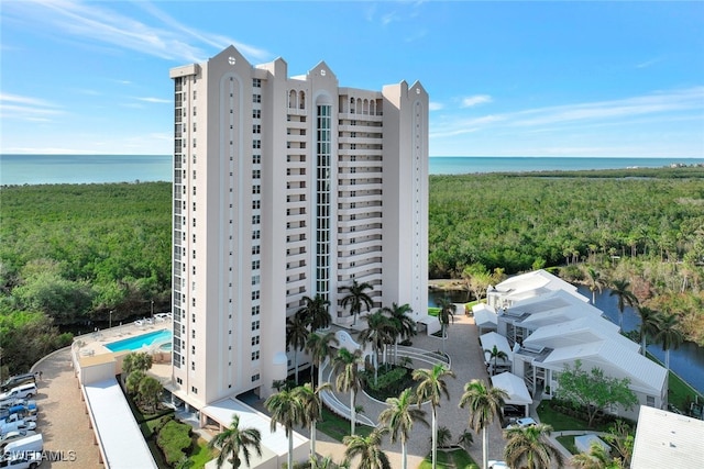 view of building exterior with a water view