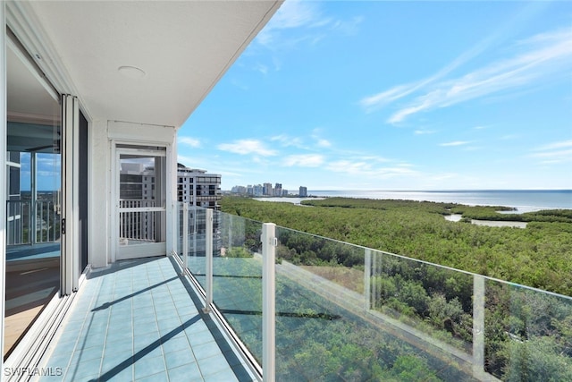 balcony featuring a water view