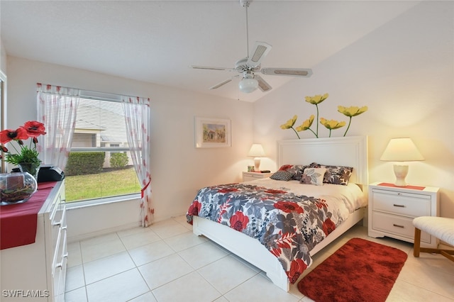 tiled bedroom with vaulted ceiling and ceiling fan