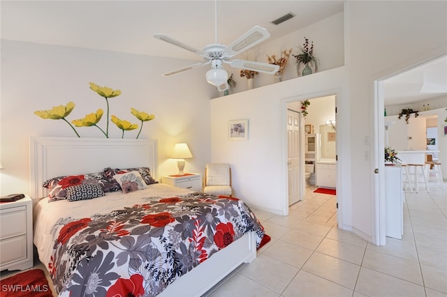 bedroom featuring connected bathroom, high vaulted ceiling, ceiling fan, and light tile patterned flooring