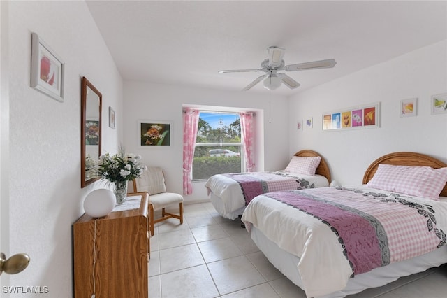 bedroom featuring ceiling fan and light tile patterned flooring