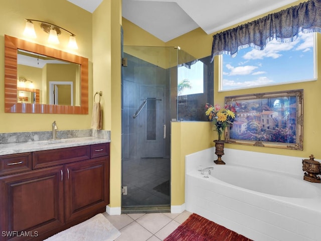 bathroom with independent shower and bath, vanity, and tile patterned flooring