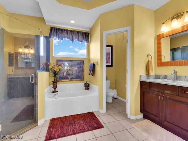 full bathroom with vanity, tile patterned floors, toilet, and independent shower and bath