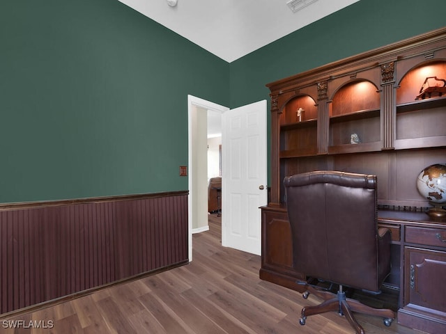 unfurnished office featuring dark hardwood / wood-style floors