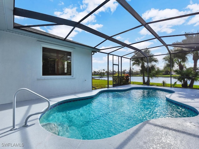 view of swimming pool with glass enclosure, a water view, and a patio area