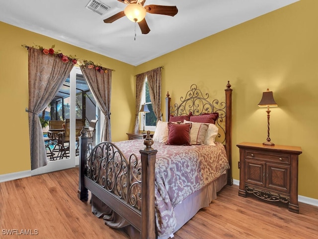 bedroom featuring access to exterior, light hardwood / wood-style flooring, and ceiling fan