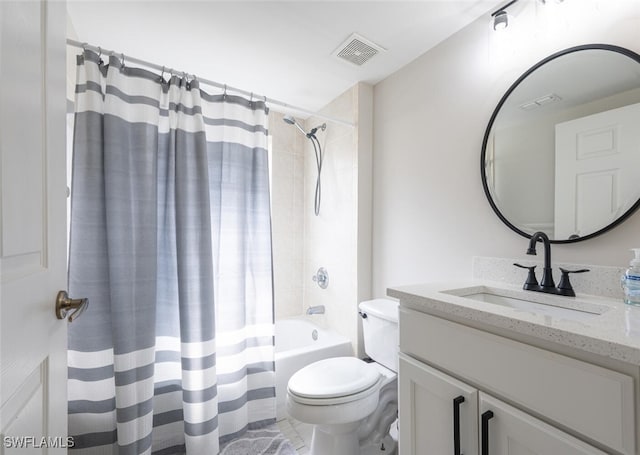 full bathroom with vanity, shower / bath combo, and toilet