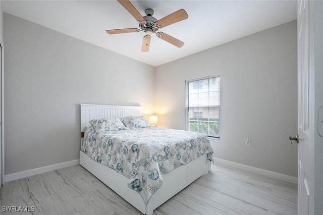 bedroom featuring light hardwood / wood-style floors and ceiling fan