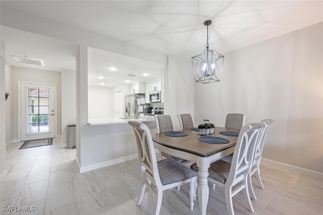 dining area with a chandelier