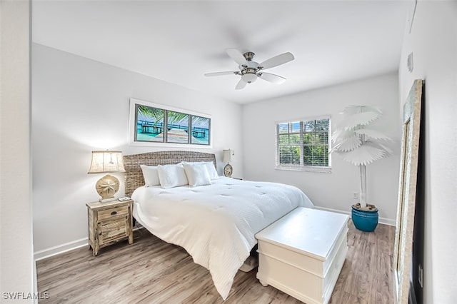 bedroom featuring light hardwood / wood-style flooring and ceiling fan