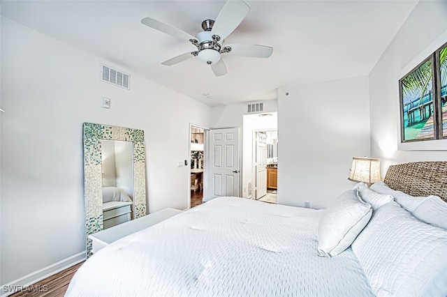 bedroom featuring ensuite bathroom, hardwood / wood-style floors, and ceiling fan