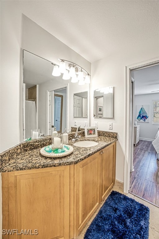 bathroom featuring vanity and hardwood / wood-style floors