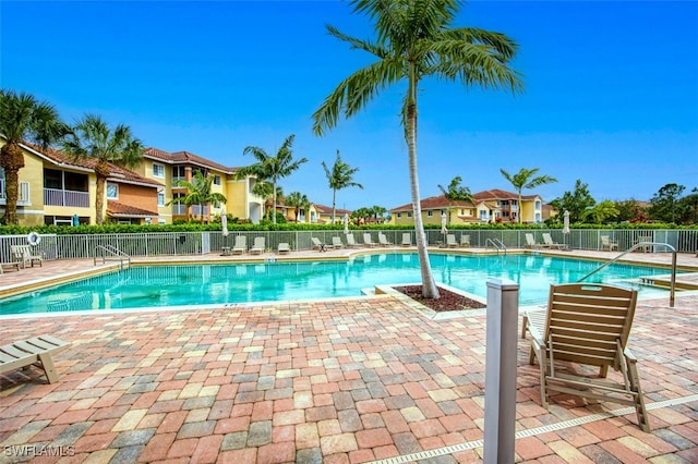 view of swimming pool with a patio