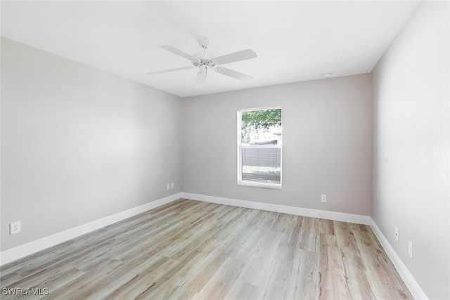 empty room featuring light hardwood / wood-style floors and ceiling fan