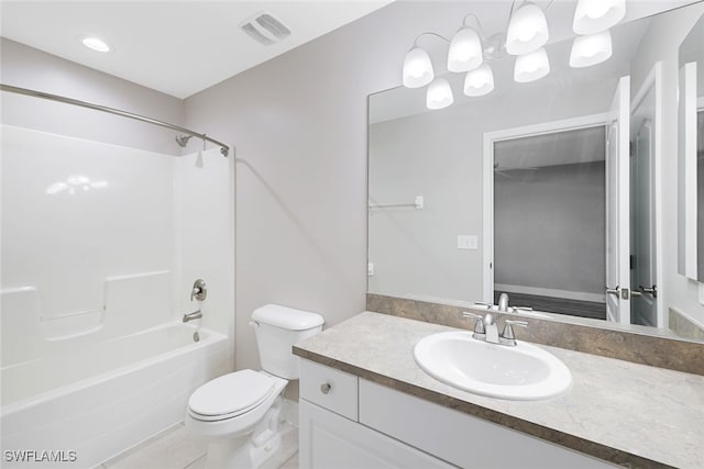 full bathroom featuring tile patterned floors, vanity, toilet, and shower / bath combination