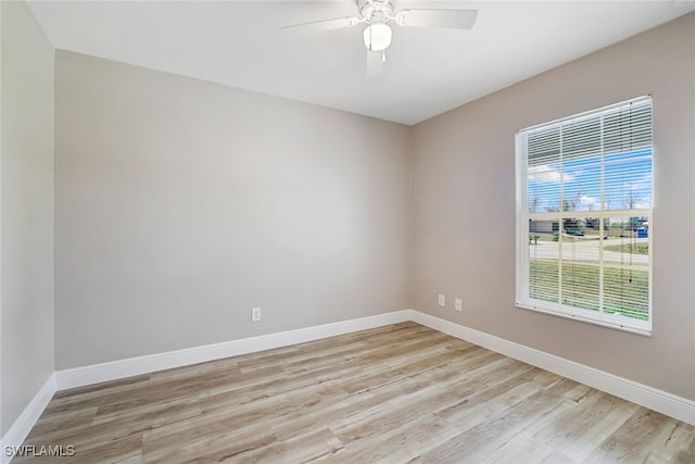 unfurnished room with ceiling fan and light wood-type flooring