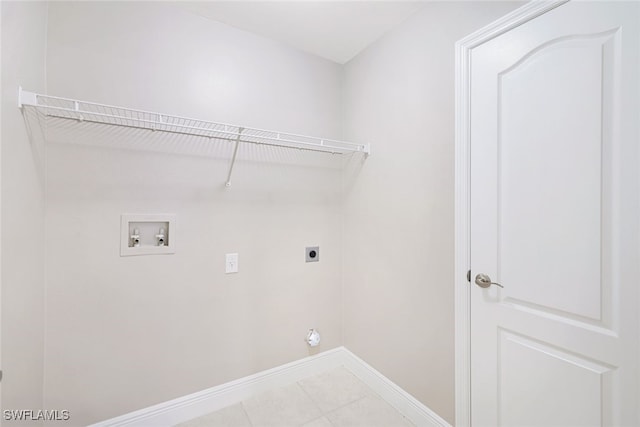 clothes washing area featuring light tile patterned floors, washer hookup, and hookup for an electric dryer