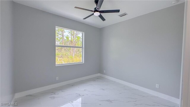 unfurnished room with ceiling fan