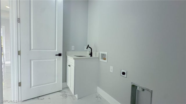 washroom featuring sink, hookup for a washing machine, cabinets, and hookup for an electric dryer