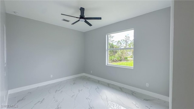 unfurnished room with ceiling fan