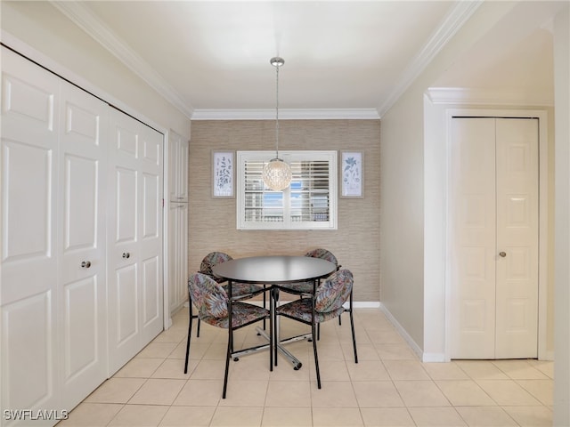 1925 Clifford St Unit 1202, Fort Myers, FL 33901 - dining room with ornamental molding, baseboards, light tile patterned floors, wallpapered walls, and an accent wall
