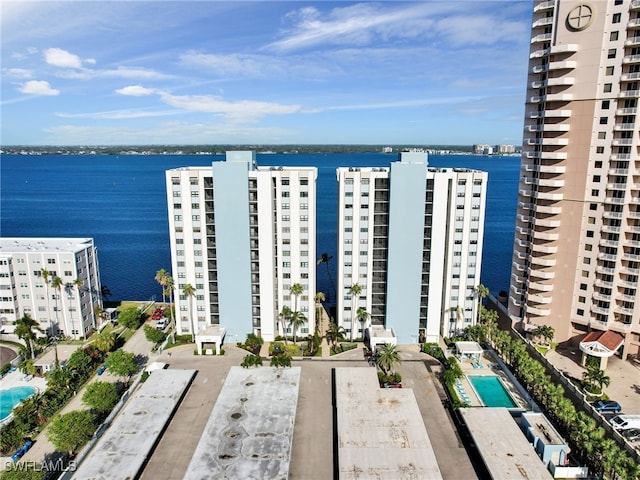 birds eye view of property with a water view