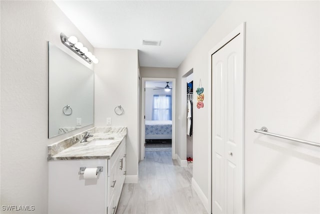 bathroom featuring vanity and ceiling fan