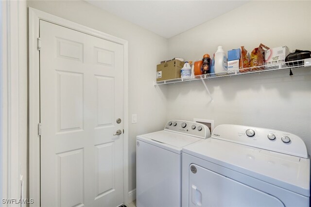 washroom featuring washer and dryer